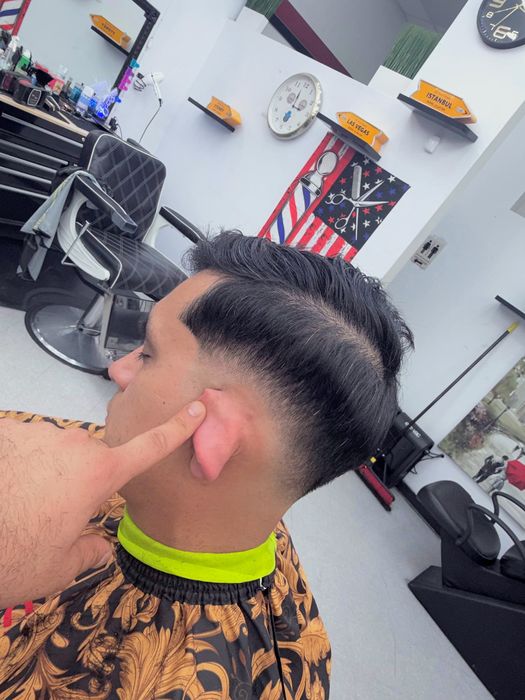 Low fade with a hard part